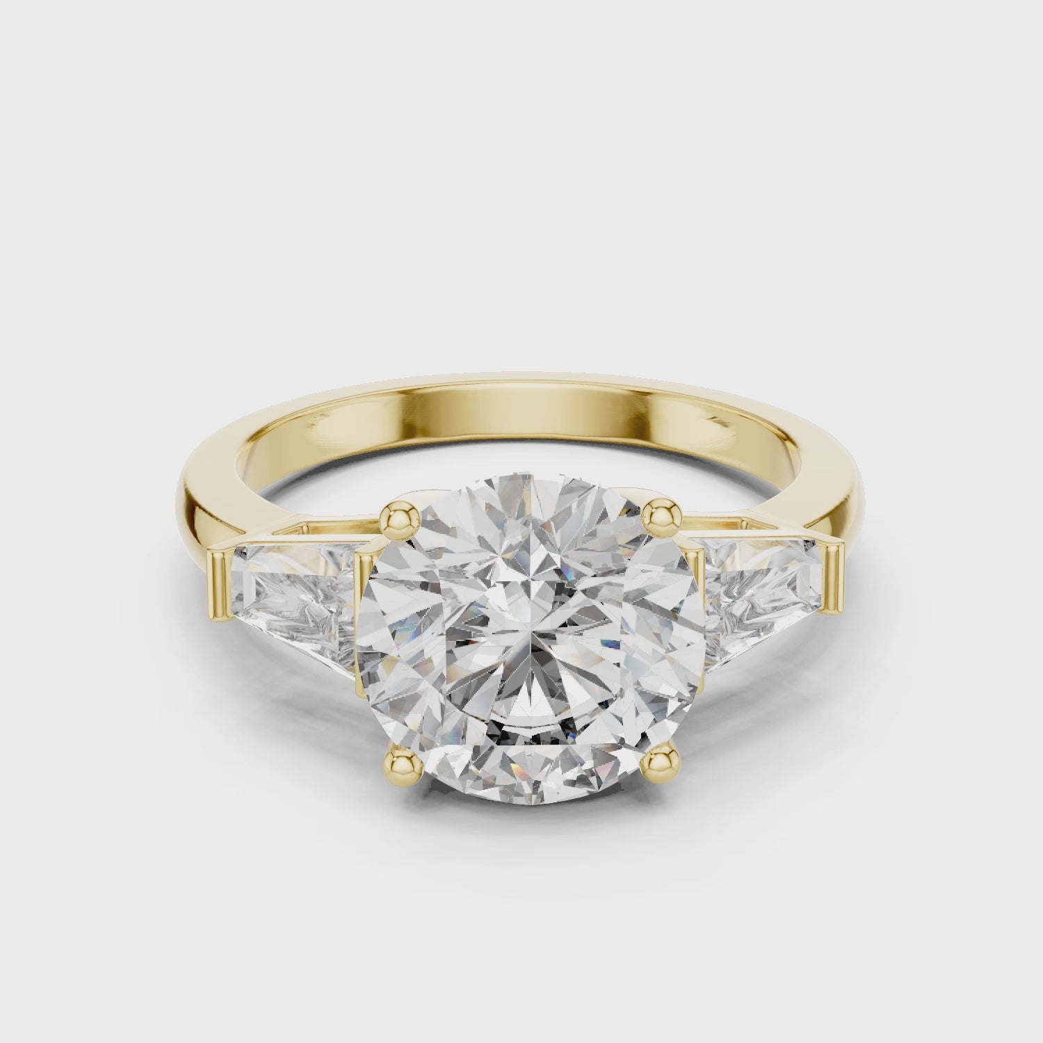 Brinda Gold and Diamonds Round Solitaire & Tapered Baguette Side Stones Diamond Ring