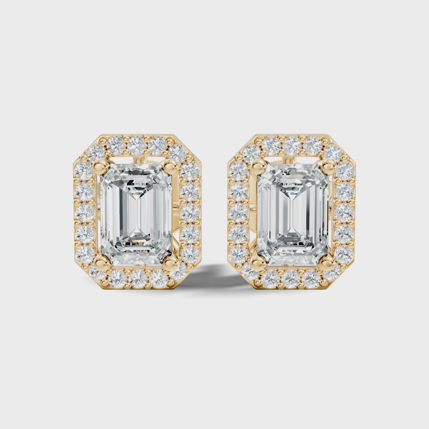 Emerald Cut Solitaire & Diamond Octagon Halo Stud